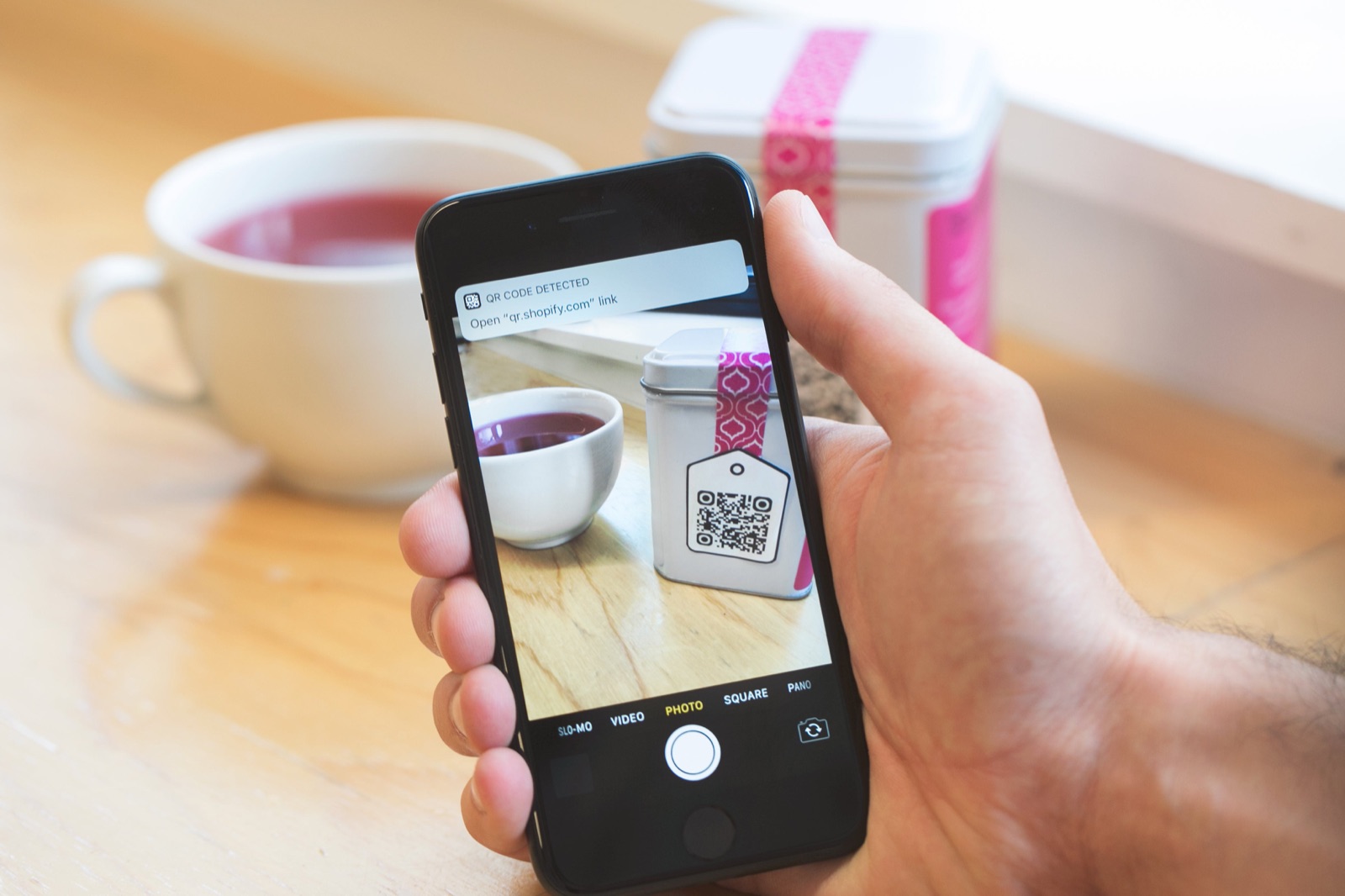 Customer scanning an Aani QR code to pay